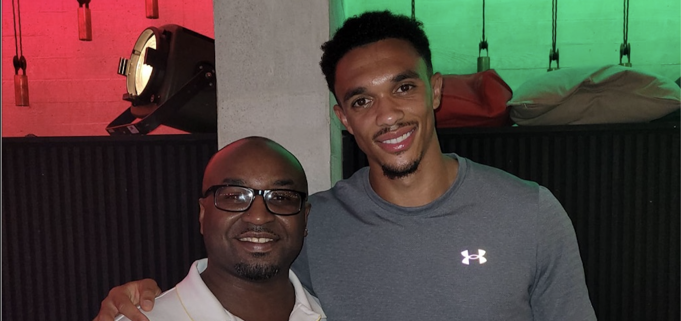 Kevin Stuart (left) posing with Trent Alexander-Arnold at an indoor event.